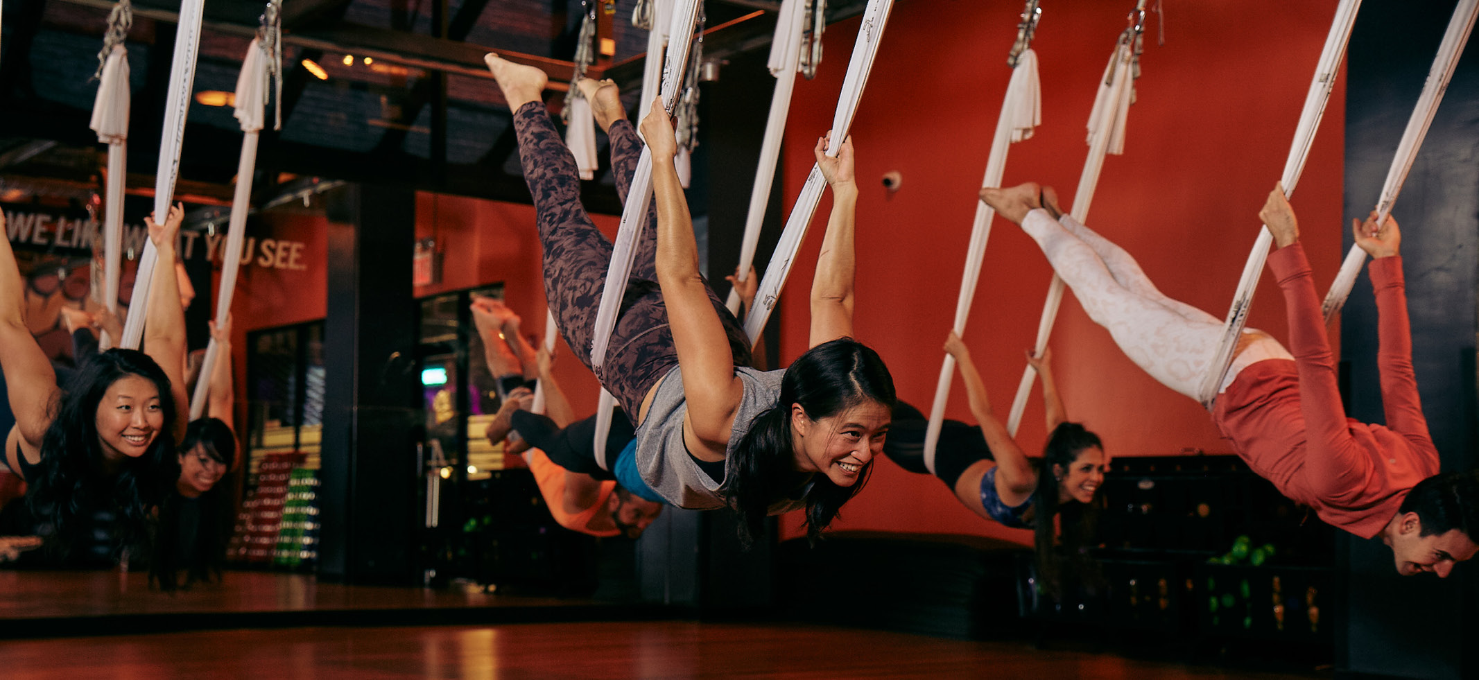 People doing aerial yoga